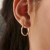 Gold-plated silver hoop earrings in a classic rounded shape