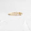 Sterling silver band with graceful interwoven pattern and stones