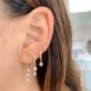 Sterling silver hoop earring featuring three bezel-set CZ stones