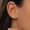 Gold-plated sterling silver earrings in a graceful leaf motif