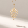 Nature-inspired charm necklace with a slender leaf motif