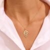 Leaf pendant charm necklace measuring 31.00mm by 16.70mm