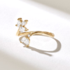 Floral ring with leaf-inspired end and pave stones