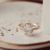 Diamond oval pave band solitaire ring in polished gold plating