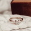 Classic ring with a polished silver finish and oval diamond detail