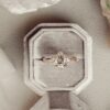 Pear-shaped diamond ring with pave stone setting