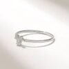 Diamond tiny clover ring with a delicate floral-inspired motif