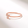Minimal clover ring with a petite four-stone design