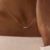 Elegant trivet-inspired necklace with delicate stone arrangement