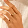 Thick gold-plated sterling silver ring with twisted rope-inspired design