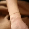 Elegant wishbone charm bracelet with symbolic, simple styling