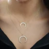 Gold-plated sterling silver necklace with balanced double horn shape