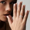 Anniversary ring with prong settings and continuous sparkle effect
