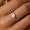 Engagement ring with emerald pie cut CZ diamond and invisible bezel setting