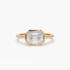 East-west engagement ring with refined stone arrangement and polished metal