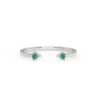 Open cuff style ring with two emerald stones
