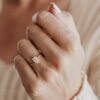 Polished sterling silver ring with a balanced solitaire style