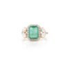 Cocktail ring with an octagon-cut emerald and diamond accents