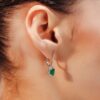 Dangle earrings with two emerald-cut stones and refined diamond sparkle