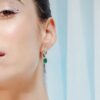 Sterling silver earrings highlighting 7.15 by 5.9 mm emerald-cut stones
