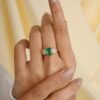 Emerald-inspired wedding ring featuring a 7.96 x 6.02 mm stone
