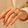 Emerald engagement ring in sterling silver with thick gold plating