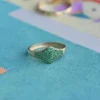 Sterling silver signet ring featuring a premium CZ emerald and pave setting