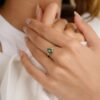 Sterling silver ring featuring a bezel-set premium CZ emerald