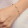 925 Sterling Silver bracelet featuring a bezel-set emerald accent