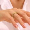 Pave-set premium CZ emerald stone ring with a continuous band of sparkle
