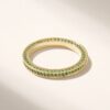 Refined ring design with continuous stones and a timeless pave finish