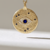 Evil eye necklace with pave-set sapphire-look stones