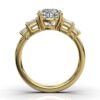 Prong-set ring with four emerald-shaped side stones