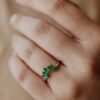 Sterling silver tracer band with curved emerald-inspired stones