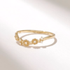 Curved stackable ring with delicate floral top design