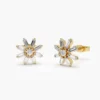 Floral design sterling silver stud earrings with baguette accents