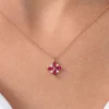 Gold-plated pendant featuring marquise ruby stones and round diamond accents