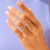 Simple wedding band with open stone placement and half-eternity setting