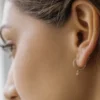 Gold-plated sterling silver hoop earrings with diamond detail