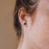 Simple stud earrings with rich green malachite and polished silver finish