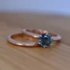 Sterling silver solitaire engagement ring set with blue-green stone