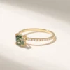 Minimal solitaire ring featuring an earthy moss agate stone
