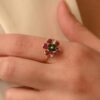 Bezel-set sterling silver ring with emerald, ruby and sapphire tones