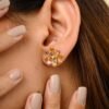Floral stud earrings with 24 CZ sapphires and small diamonds