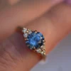 Nature inspired sterling silver engagement ring with light blue sapphire