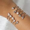 Oval and baguette stone bangle in thick gold-plated silver