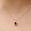 Ruby halo necklace with a classic balanced pendant design