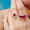 Sterling silver ring with oval ruby and halo