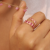 Ring with oval ruby stones in bezel settings