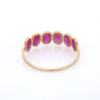 Oval ruby band ring with 5 x 3 mm stones